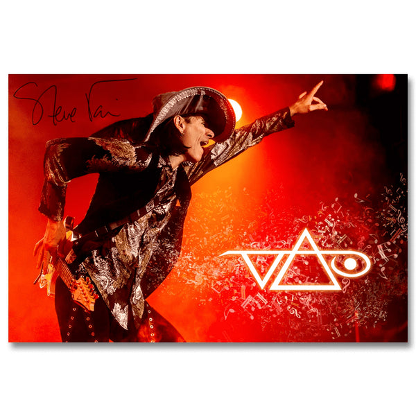 orange and black rectangular poster against white background. image of steve vai on stage, pointing towards a crowd. the crowd is not visible in the picture. the top left has his signature in black marker. the bottom right features the steve vai logo in white, surrounded by white music notes. The steve vai logo makes the word "vai" with an upside down triangle, a right side up one, and a line going across the triangles with a curl at the end next to the triangle that is upright. 