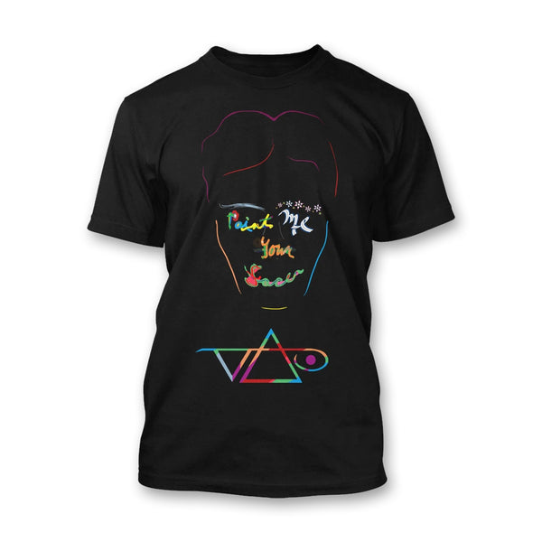 black tshirt against white background. the tshirt features an outline of a persons face in rainbow coloring. one eyebrow is white and feathery looking, the other made from colorful flowers. the center of the face reads "paint me your face". below the outline is the steve vai logo in rainbow color. The steve vai logo makes the word "vai" with an upside down triangle, a right side up one, and a line going across the triangles with a curl at the end next to the triangle that is upright. 