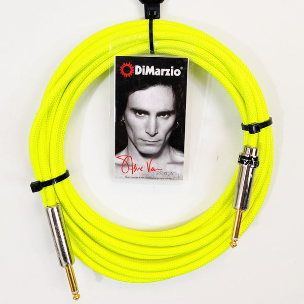 image of a neon yellow guitar cable with gold ends against white background. the black cable has a tag that features a black and white photo of steve vai, photographed from the neck up. above steve's head reads "dimarzio" in white text. below steve in red cursive are the words "steve vai".