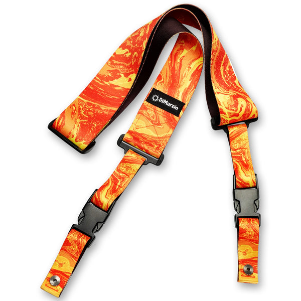 Image of an abstract colorful clip lock guitar strap against white background. the guitar strap clips together with black clips and has a small black patch that says "DiMarzio". the strap is an orange and yellow abstract marbled swirl pattern. 