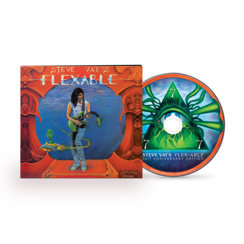 Image of steve vai's flexible cd case and cd against white background. the artwork is red with a blue circle in the center. standing by the blue circle is steve vai playing a green guitar. the neck of the guitar droops down. swirling around steve is an alien in a small ship. above this in blue and white text reads "steve vai's flexable". the cd has a green triangle with beams coming out of it, and each tip of the triangle has a white number 7.