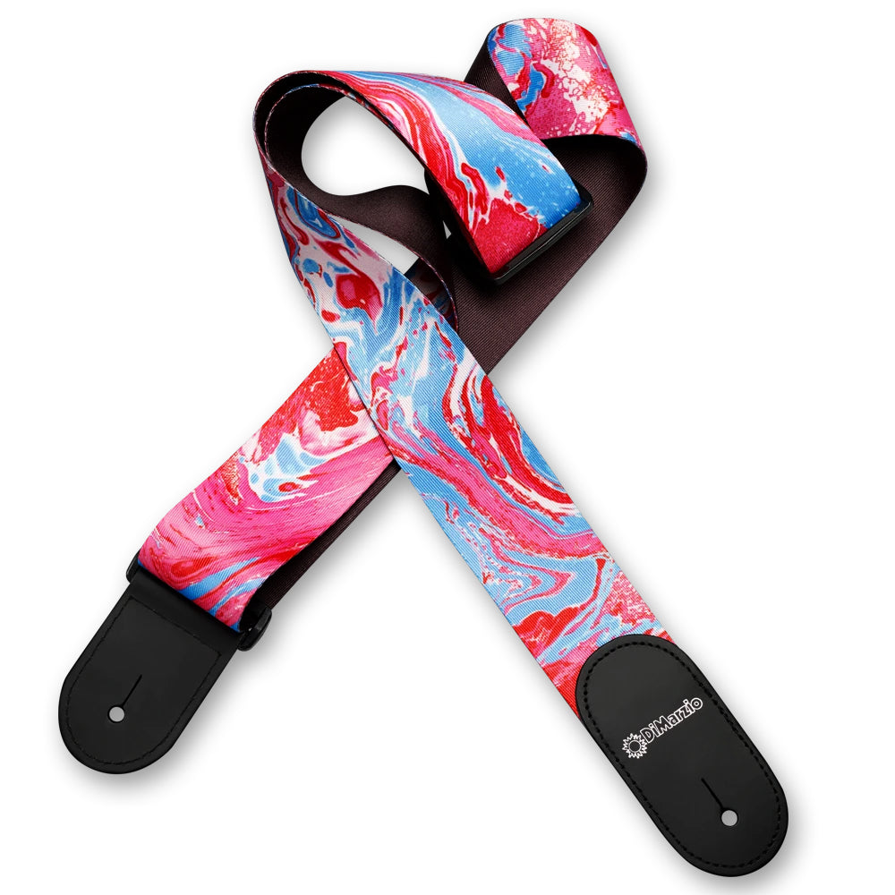 Image of a colorful guitar strap against white background. the guitar strap has black at the bottom where it attaches to the guitar and in white says "DiMarzio". the strap is a pink, blue, and white abstract marbled pattern.