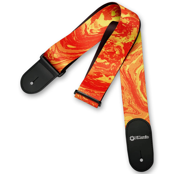 Image of a colorful guitar strap against white background. the guitar strap has black at the bottom where it attaches to the guitar and in white says "DiMarzio". the strap is an orange and yellow abstract marbled swirl pattern. 