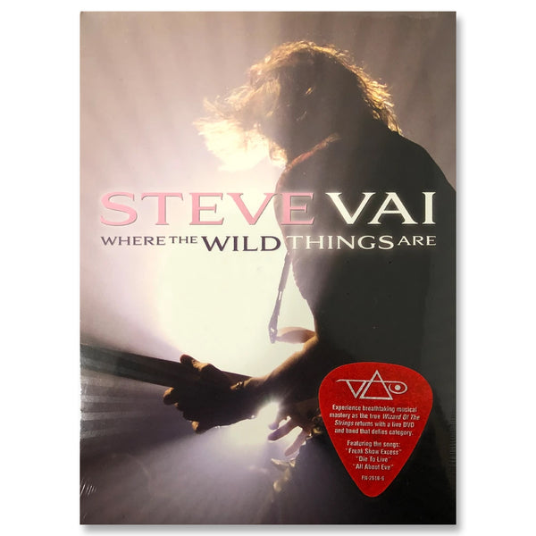 steve vai album artwork against white background. image of steve vai facing away from camera, playing guitar on stage. a white stage light shines on him. across this image in pink, white, and black text reads "where the wild things are". the bottom right has a red guitar pick with the white steve vai logo on it. The steve vai logo makes the word "vai" with an upside down triangle, a right side up one, and a line going across the triangles with a curl at the end next to the triangle that is upright.  