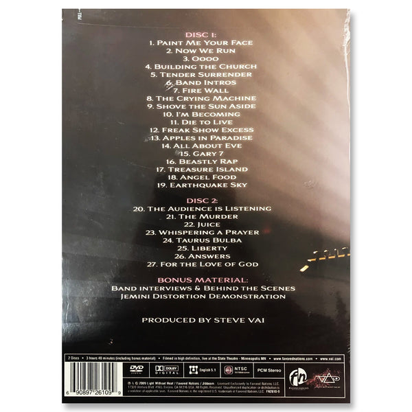 back of the where the wild things are dvd cover. the back lists the different tracks on each disk in pink and white text. the background is a pink and black background that creates stripes and looks like it is created from a stage light.