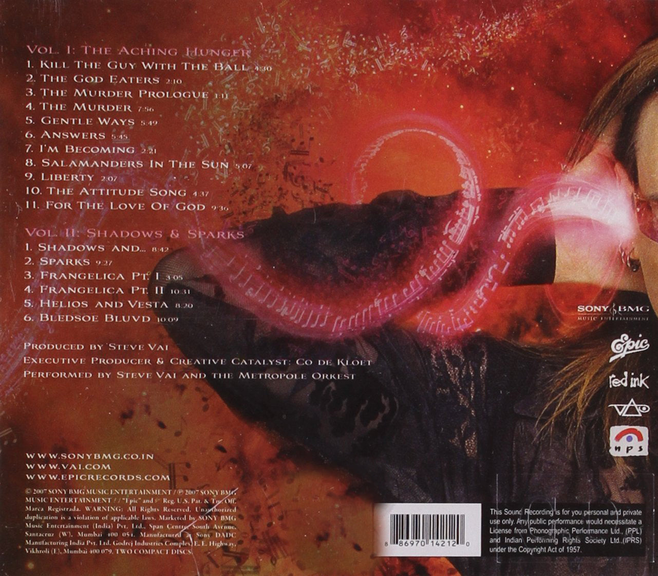 back of steve vai sound theories vol 1 and 2.  the artwork is red and black, and features the track listing in white on the left side of the art. the right side is an image of part of steve vai's face, with his hand up by his ear. he is surrounded by red dust trails and music trails.